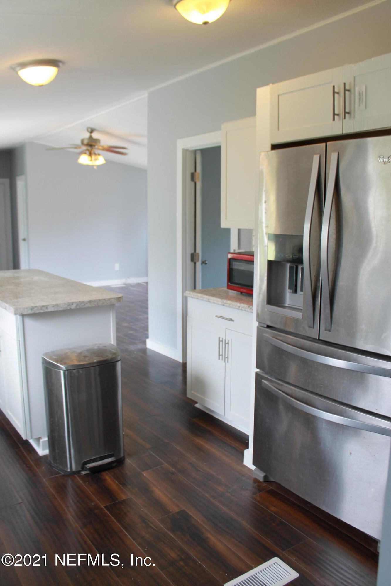 16006 Shellcracker Road Jacksonville, FL 32226 - Photo 10 of 41 a kitchen with granite countertop a refrigerator a sink and dishwasher