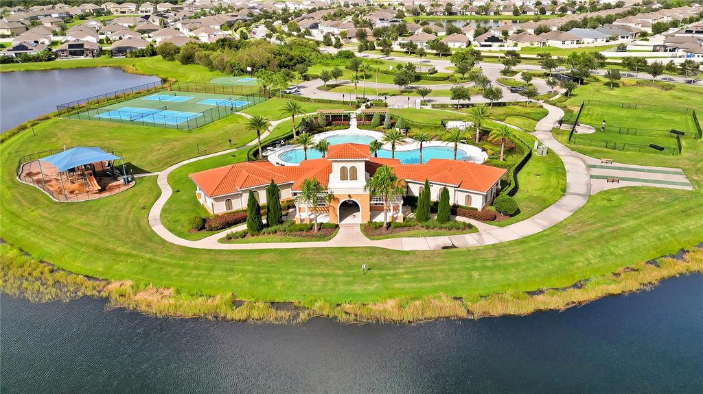 16636 Windmill Forge Pass Wimauma, FL 33598 - Photo 46 of 51 an aerial view of a house with outdoor space pool patio and lake view