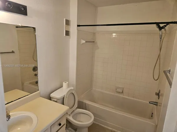 an empty room with a bench