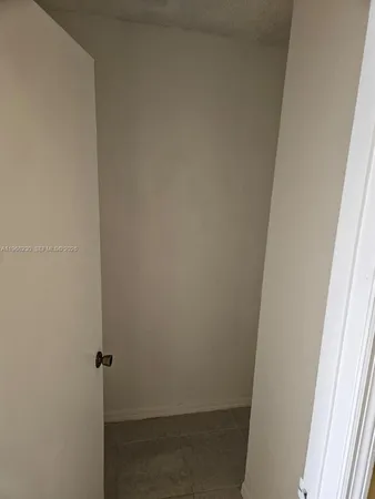 a white toilet and tub next to a bathroom sink