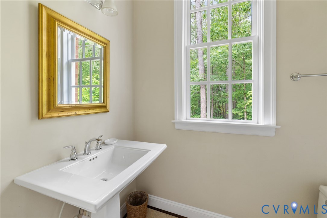 13173 Scotchtown Road Beaverdam, VA 23015 - Photo 39 of 65 a bathroom with a sink and a window