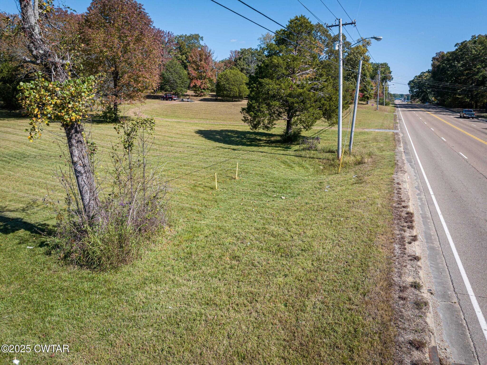 0 West Main Street Parsons, TN 38363 - Photo 11 of 15 a view of a lake with a yard