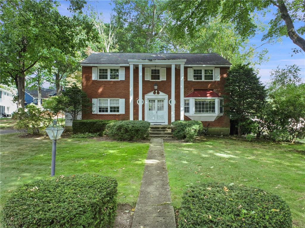 16 Country Ridge Circle Rye Brook, NY 10573 - Photo 1 of 1 a front view of a house with a yard