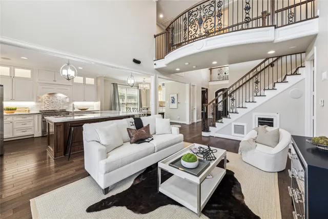 a living room with furniture and a dining table
