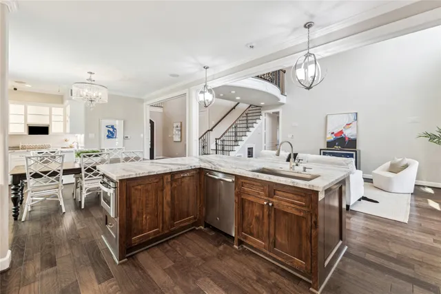 a kitchen with a sink and wooden cabinets