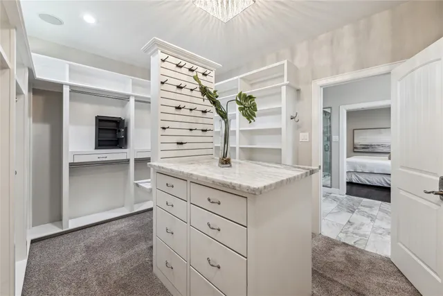 a kitchen with granite countertop a sink and a stove top oven