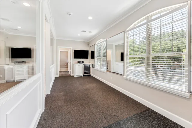 a view of a livingroom with kitchen and bathroom