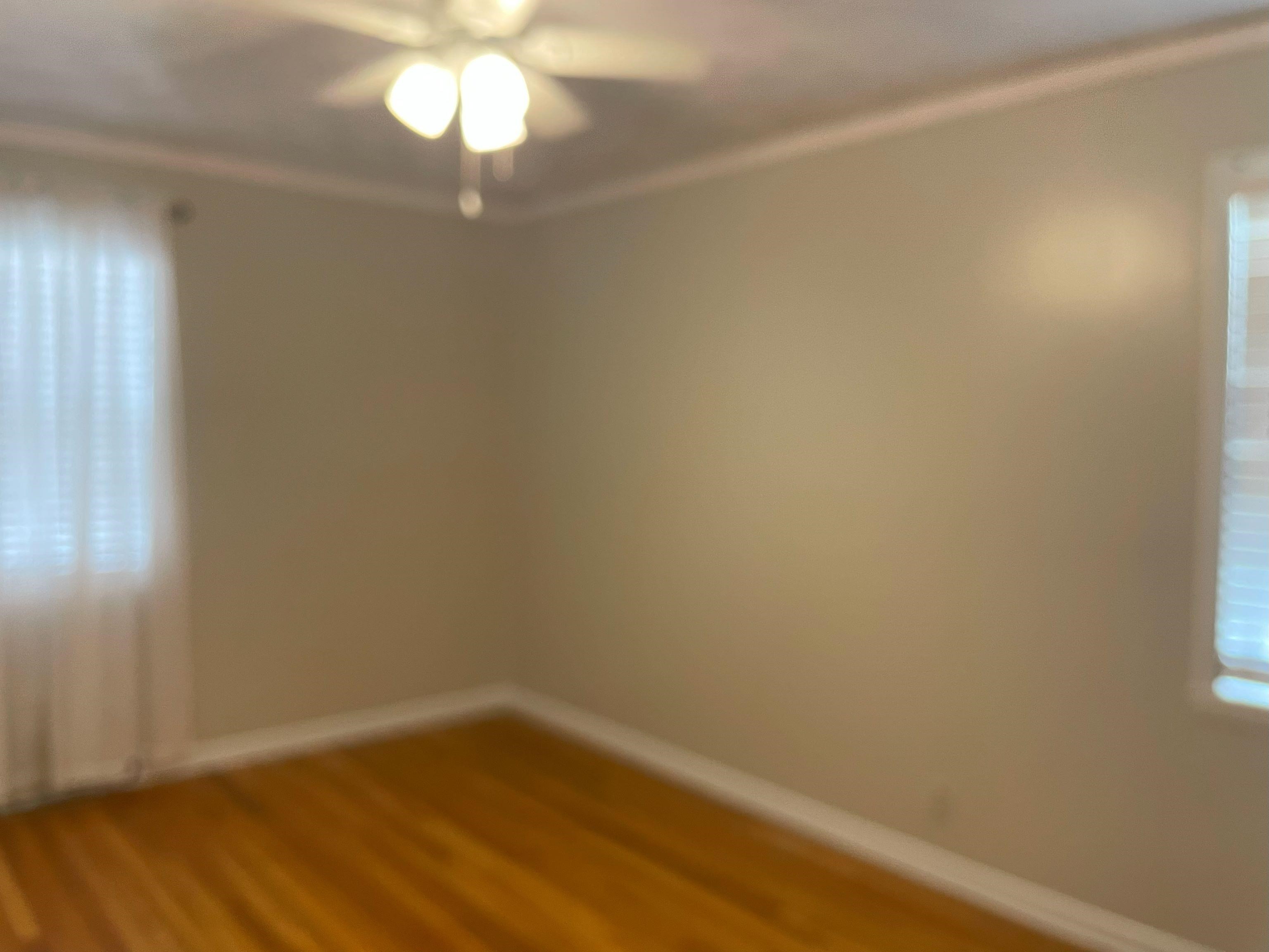 5636 Conner Whitefield Road Ripley, TN 38063 - Photo 7 of 11 a view of an empty room with wooden floor and a window