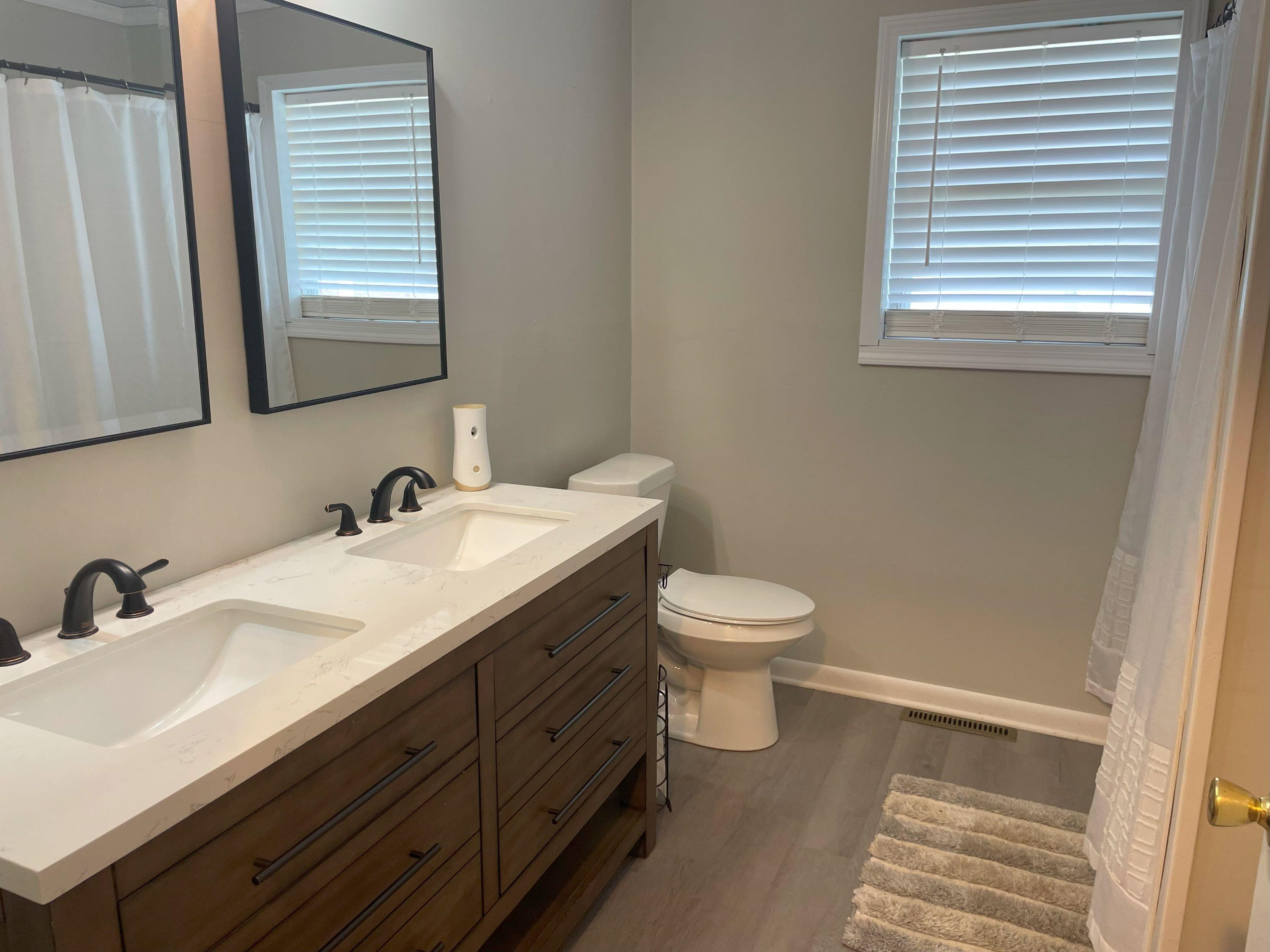 5636 Conner Whitefield Road Ripley, TN 38063 - Photo 8 of 11 a bathroom with a toilet sink and mirror