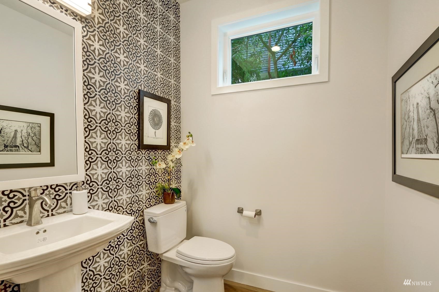 3838 36th Avenue West Seattle, WA 98199 - Photo 12 of 24 a bathroom with a toilet a sink and a window