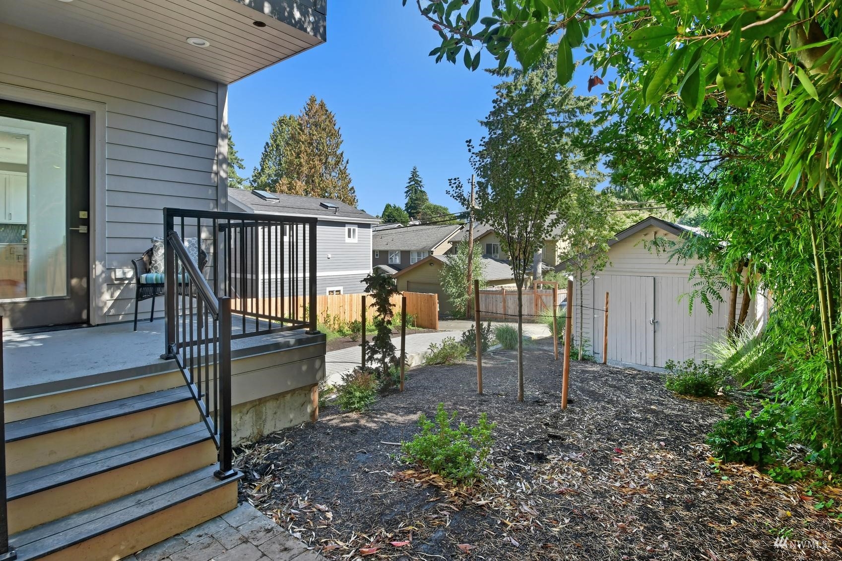 3838 36th Avenue West Seattle, WA 98199 - Photo 14 of 24 a view of a house with backyard and trees