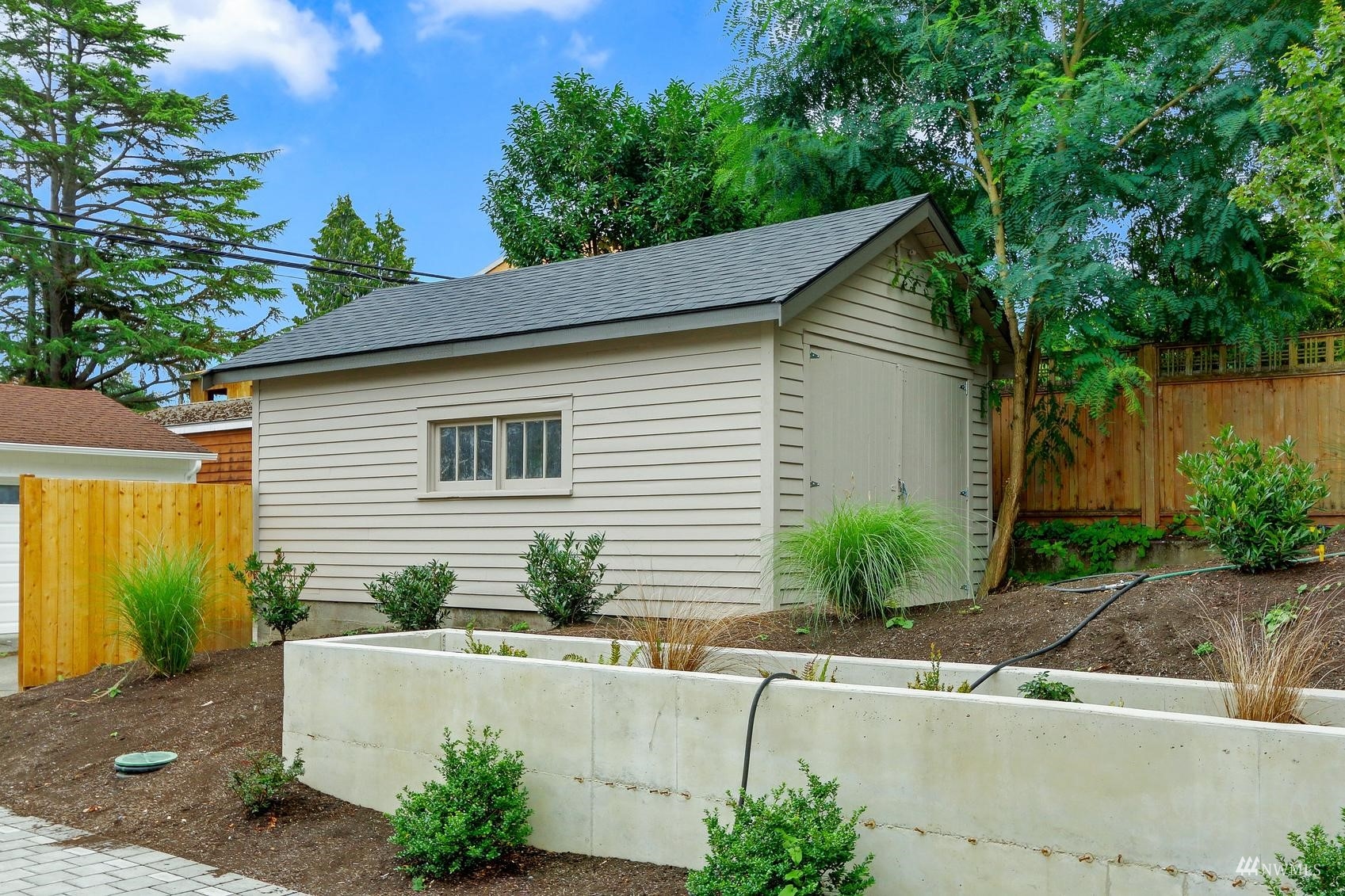 3838 36th Avenue West Seattle, WA 98199 - Photo 23 of 24 a front view of a house with garden