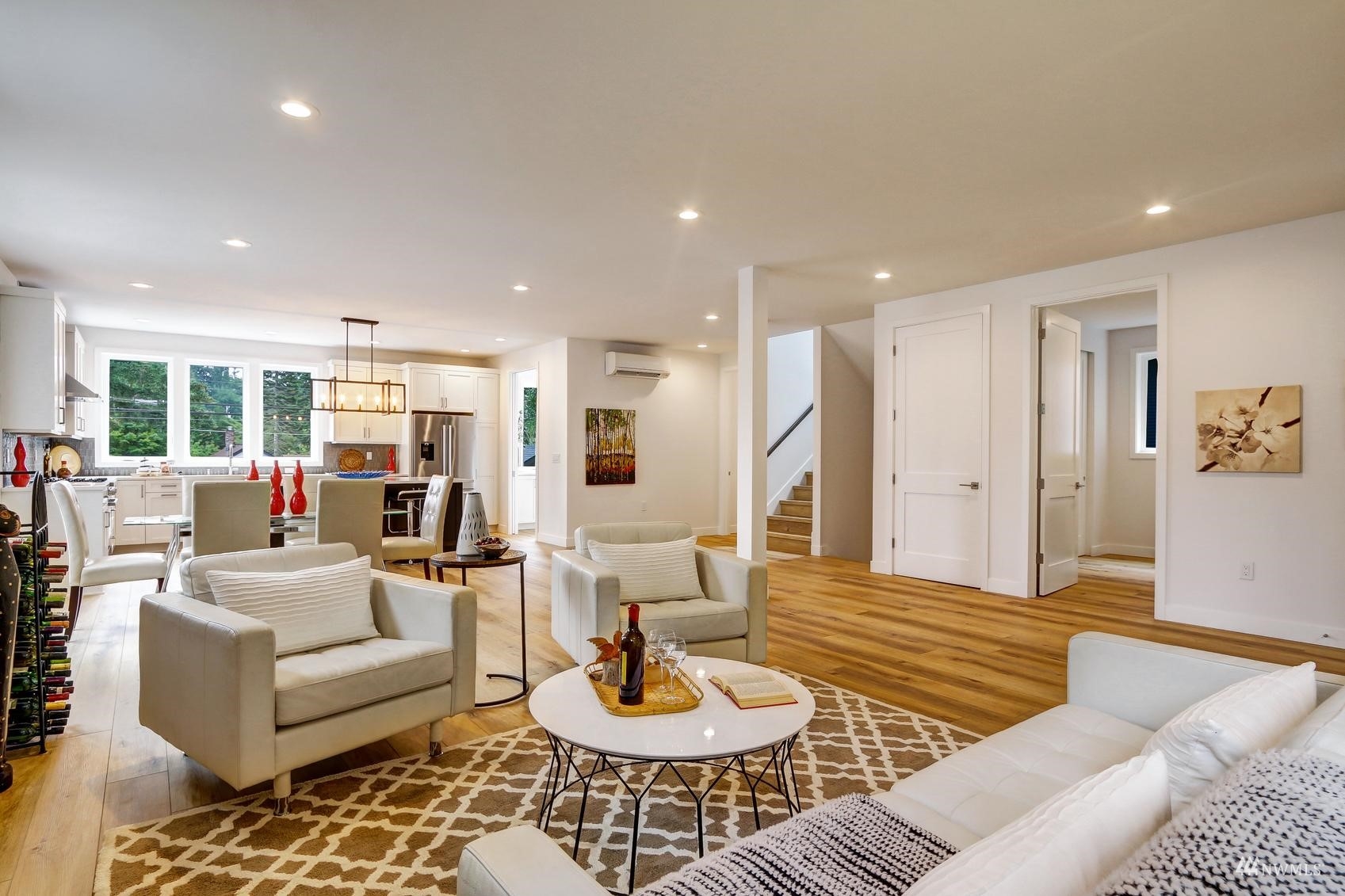 3838 36th Avenue West Seattle, WA 98199 - Photo 8 of 24 a living room with furniture and a wooden floor
