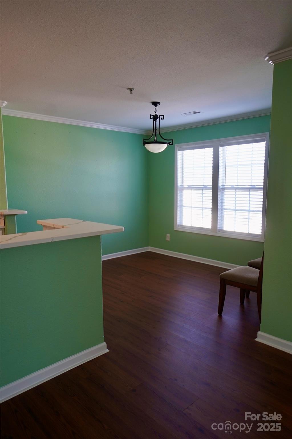 4010 Town Center Road Harrisburg, NC 28075 - Photo 3 of 13 a room with green walls and a window