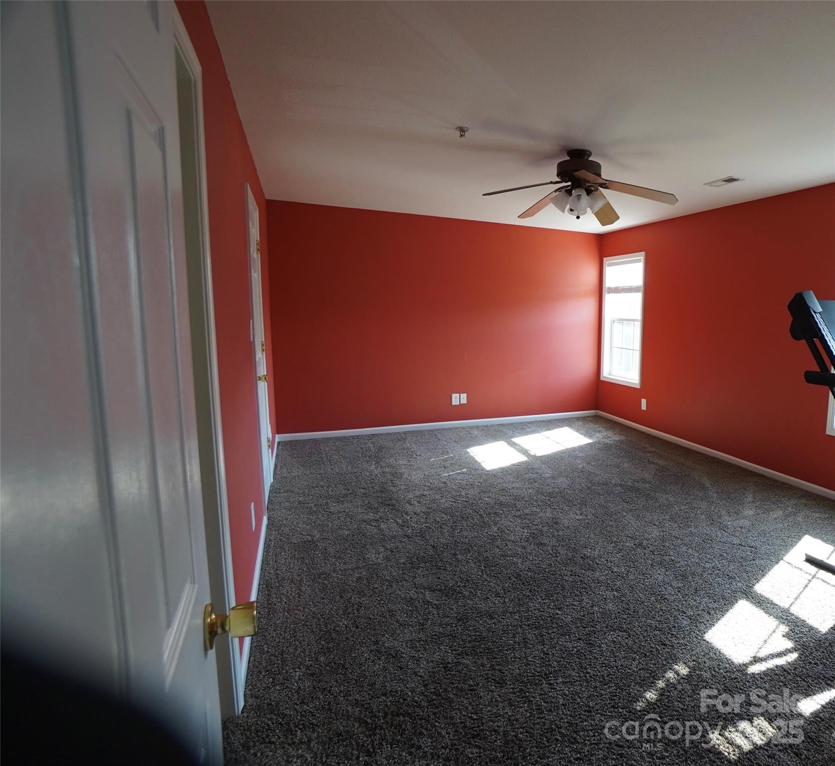 4010 Town Center Road Harrisburg, NC 28075 - Photo 6 of 13 a view of an empty room and window