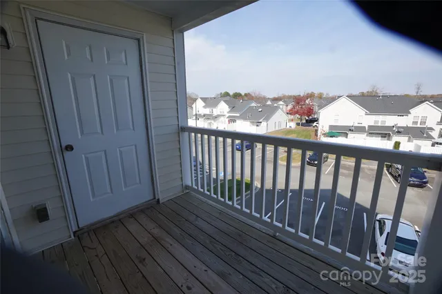 a view of balcony with wooden floor