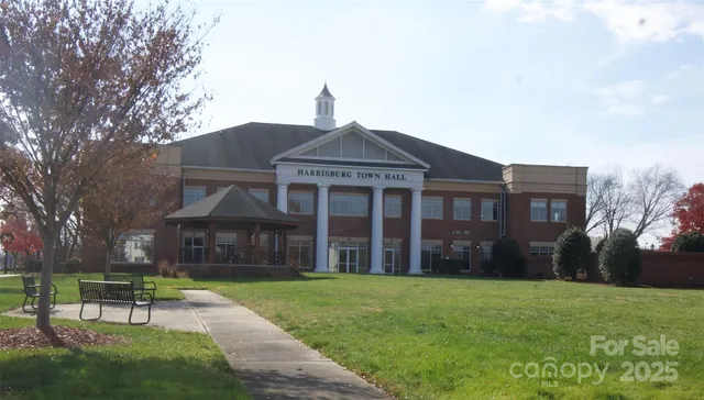 a front view of a house with a yard table and chairs
