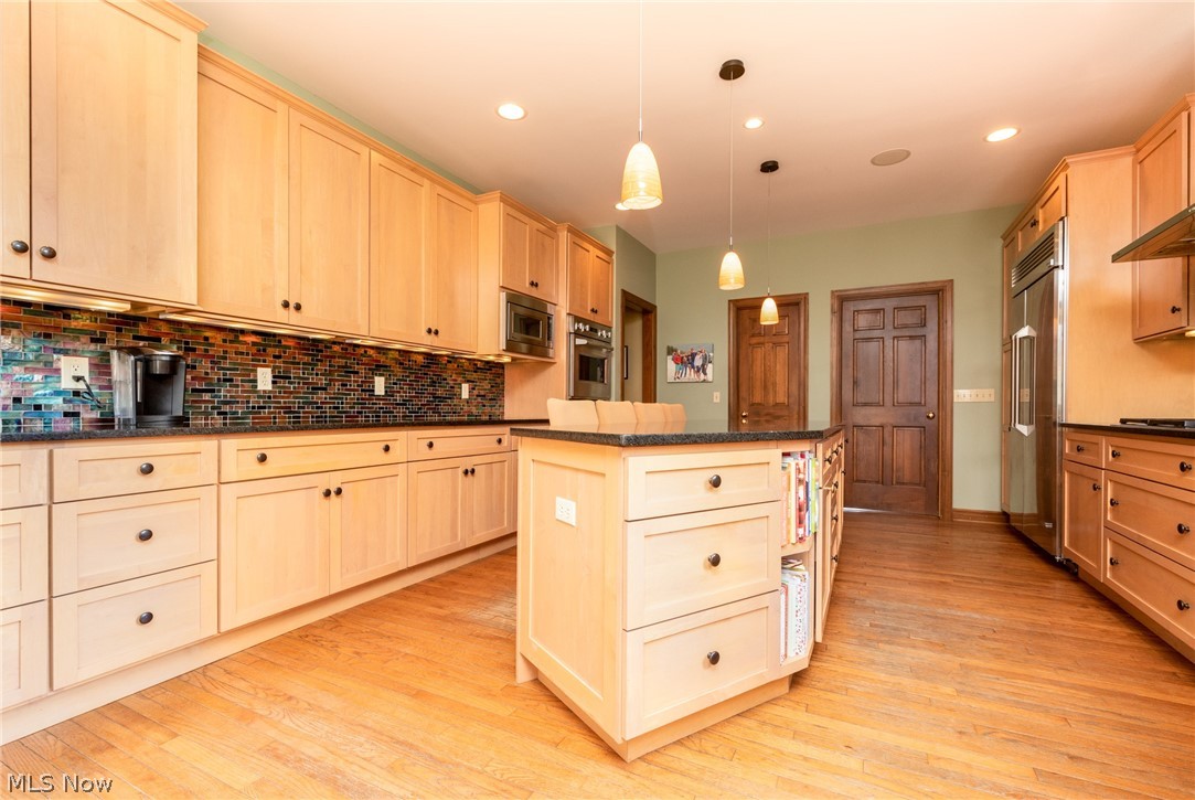 5580 High Point Road Solon, OH 44139 - Photo 12 of 35 Detailed tile backsplash adds a punch of color to the kitchen
