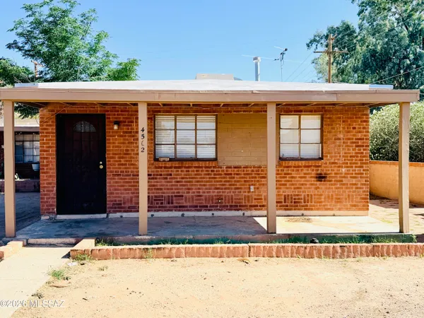 a view of a brick house with wooden floor