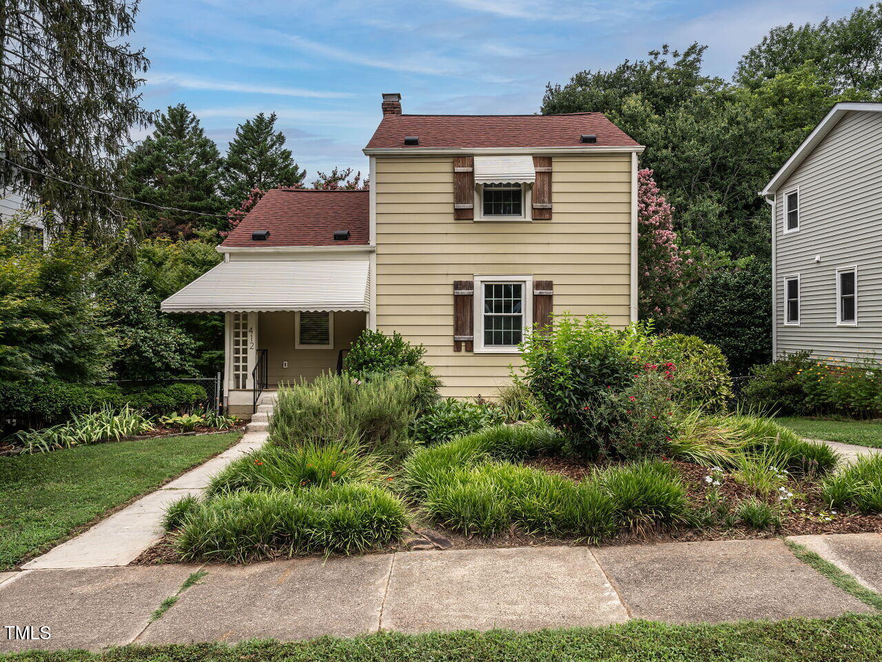 412 Morrison Avenue Raleigh, NC 27608 - Photo 1 of 26 a front view of a house with a yard