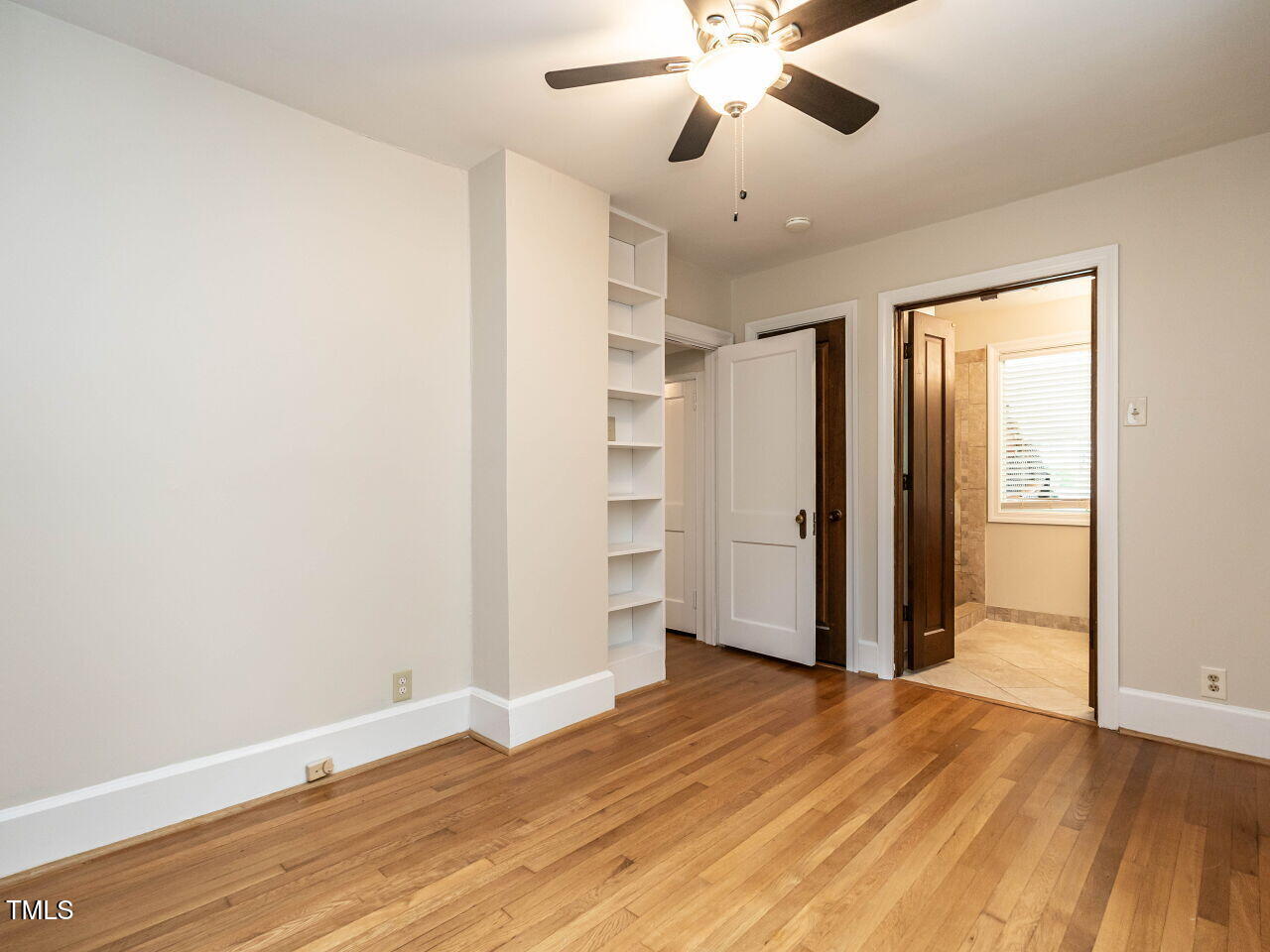 412 Morrison Avenue Raleigh, NC 27608 - Photo 13 of 26 wooden floor in an empty room with a window
