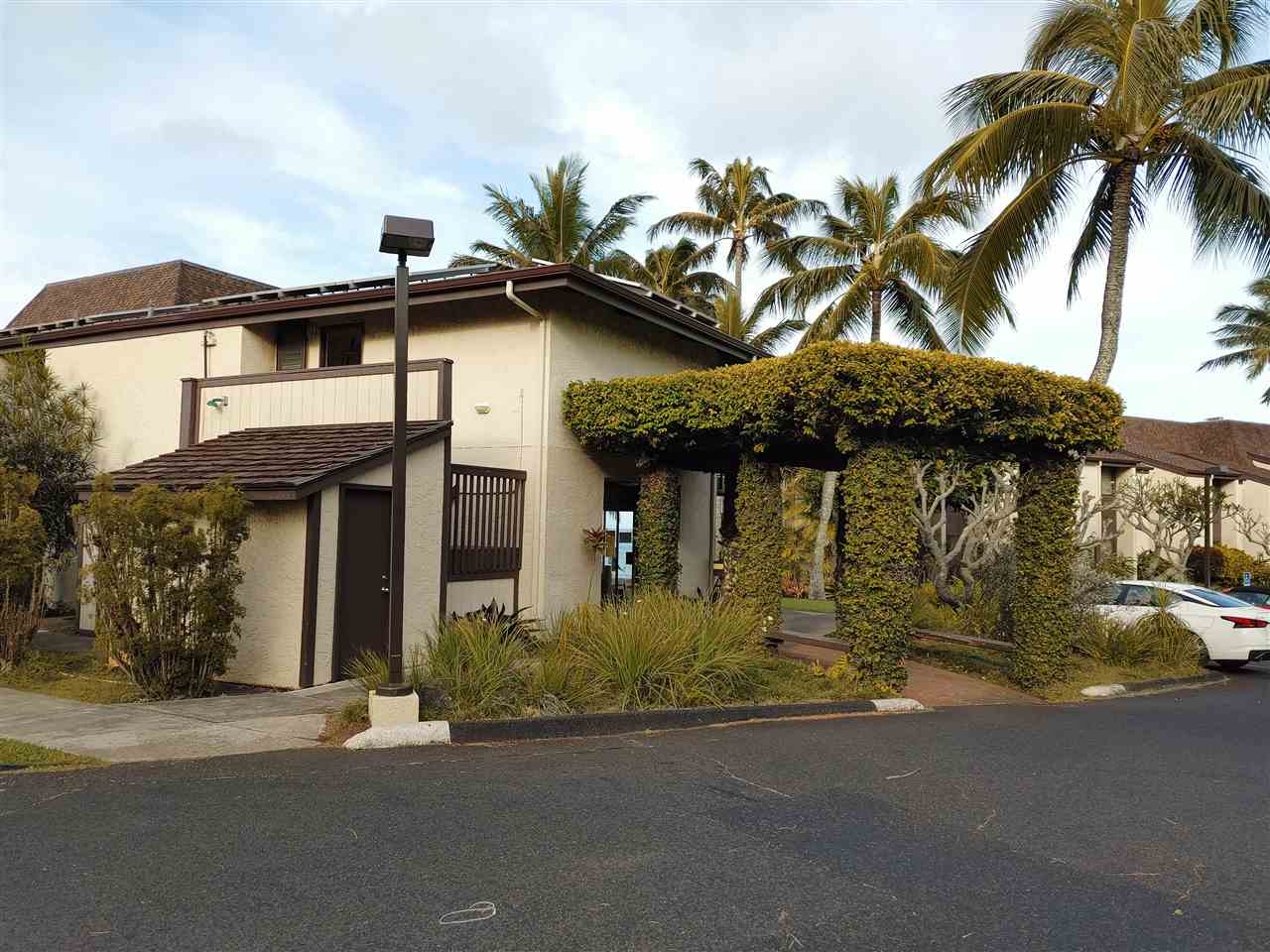 5295 Lower Honoapiilani Road, Unit A24 Lahaina, HI 96761 - Photo 11 of 23 front view of a house with a street