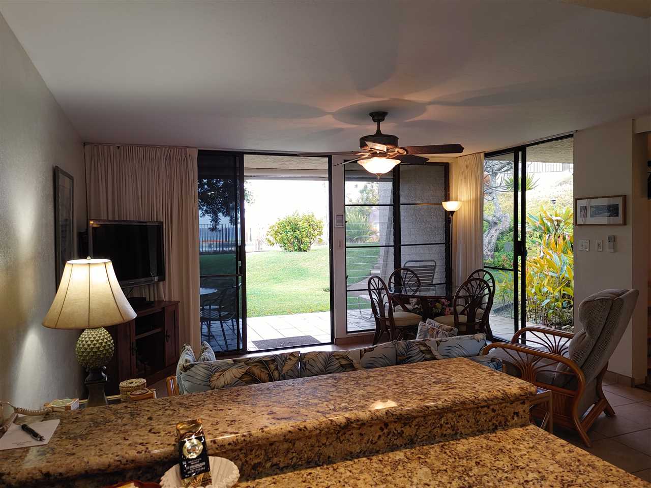 5295 Lower Honoapiilani Road, Unit A24 Lahaina, HI 96761 - Photo 3 of 23 a bedroom with a bed and large windows