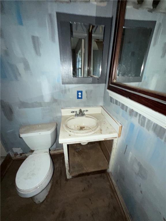 1775 Highpoint Road Snellville, GA 30078 - Photo 11 of 11 a bathroom with a toilet sink and mirror