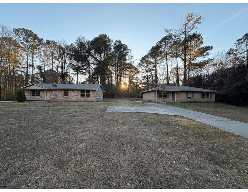 1775 Highpoint Road Snellville, GA 30078 - Photo 2 of 11 a view of a house with a yard