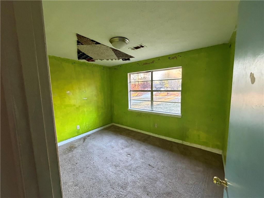1775 Highpoint Road Snellville, GA 30078 - Photo 9 of 11 a view of a room with a window and a ceiling fan
