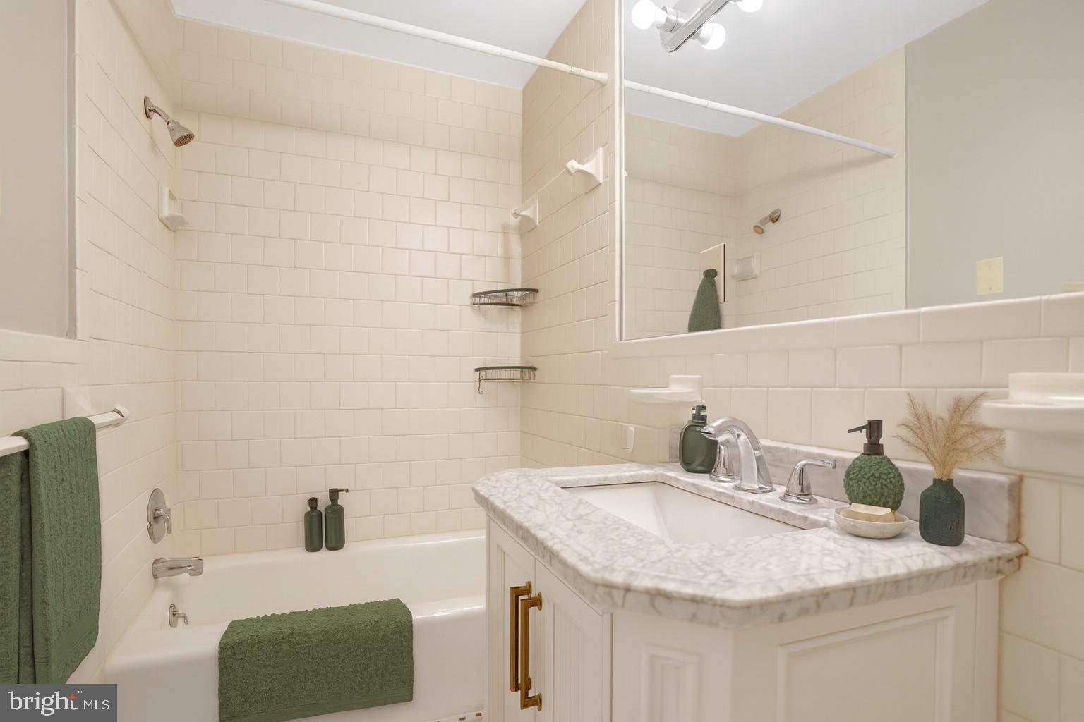411 North Bryan Street Arlington, VA 22201 - Photo 14 of 58 a bathroom with a granite countertop sink and a mirror
