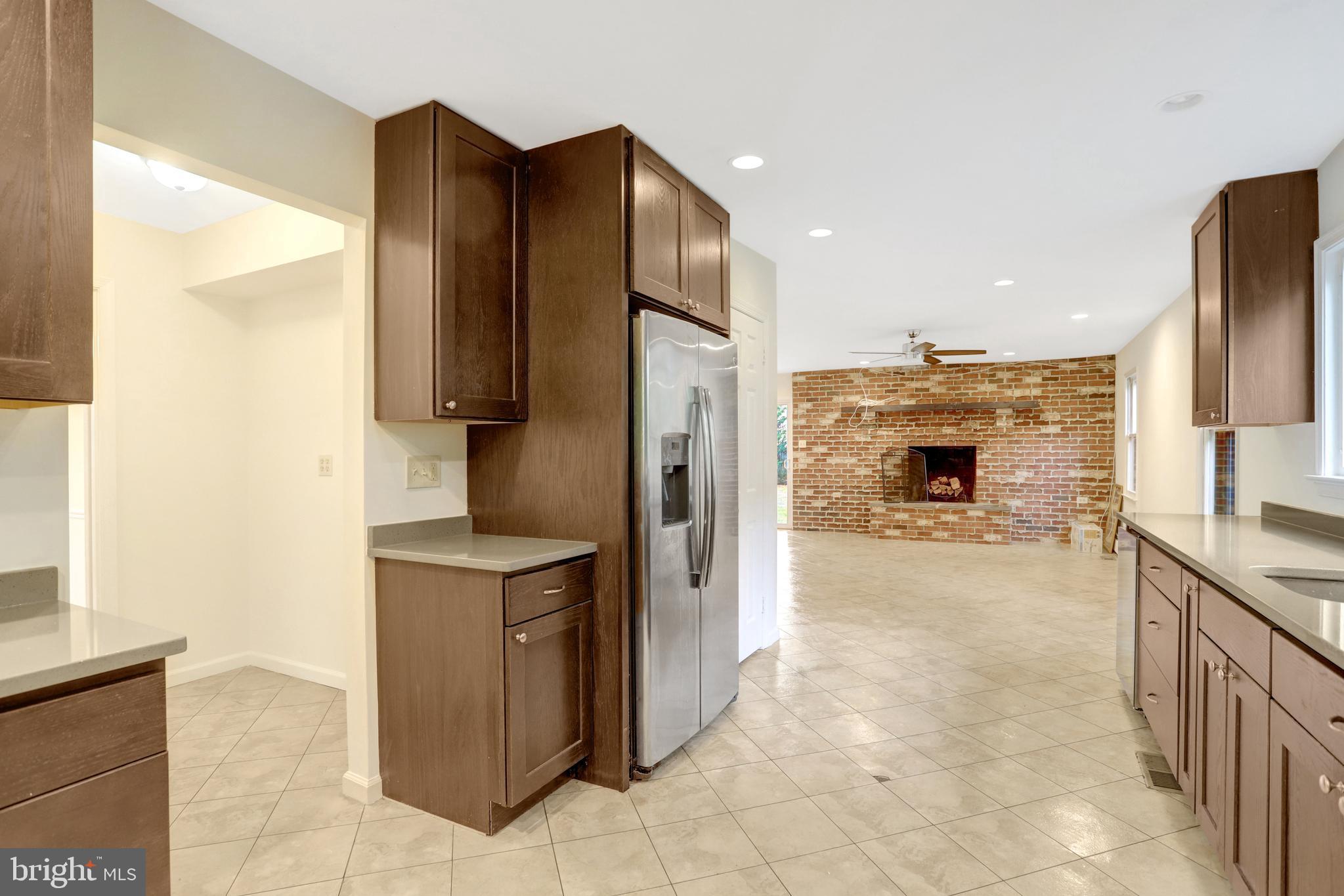 411 North Bryan Street Arlington, VA 22201 - Photo 15 of 58 a kitchen with stainless steel appliances granite countertop a refrigerator and a stove