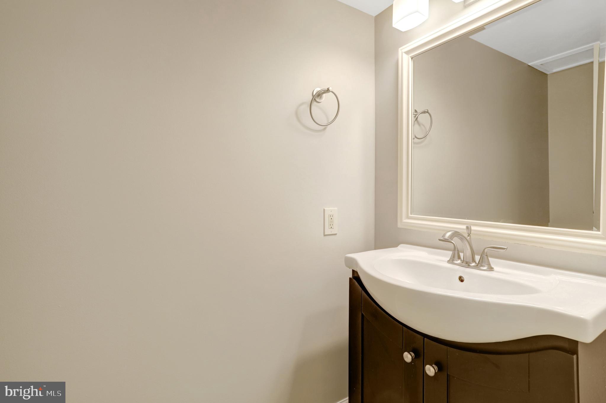 411 North Bryan Street Arlington, VA 22201 - Photo 21 of 58 a bathroom with a sink and a mirror