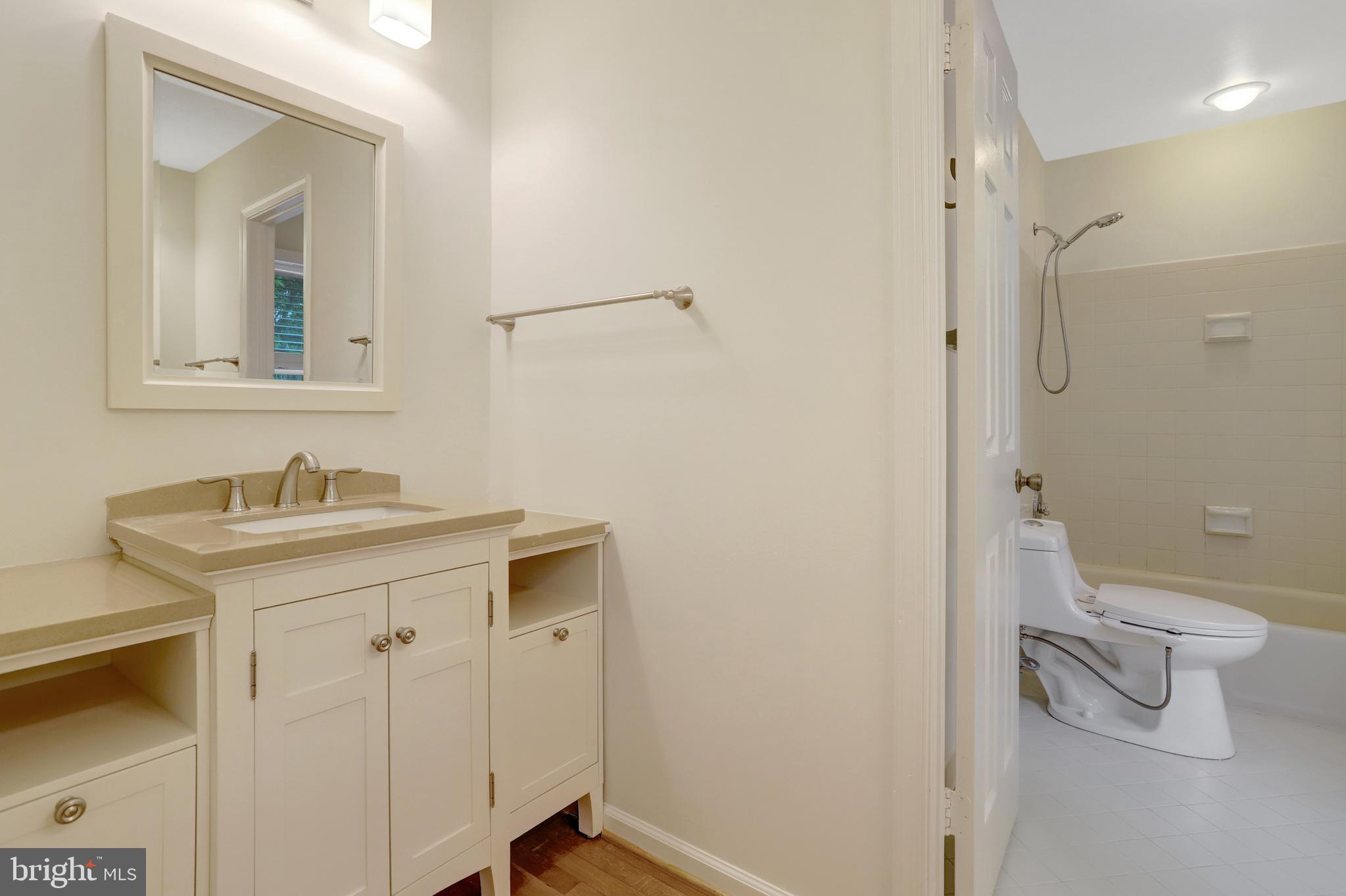 411 North Bryan Street Arlington, VA 22201 - Photo 27 of 58 a bathroom with a sink a toilet and shower