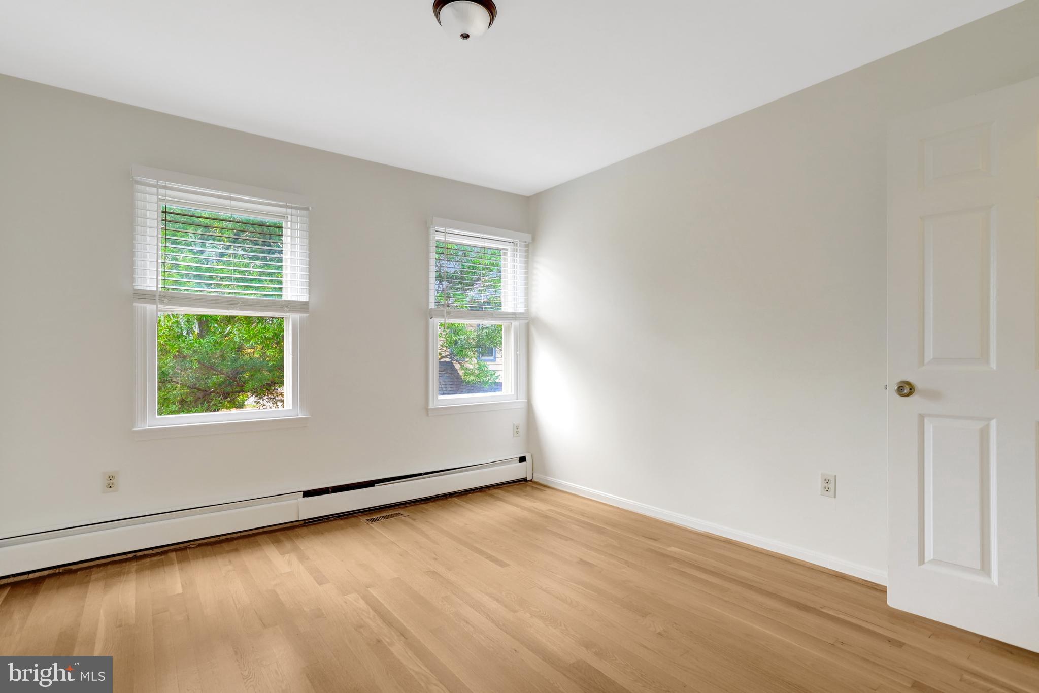 411 North Bryan Street Arlington, VA 22201 - Photo 34 of 58 an empty room with wooden floor and windows
