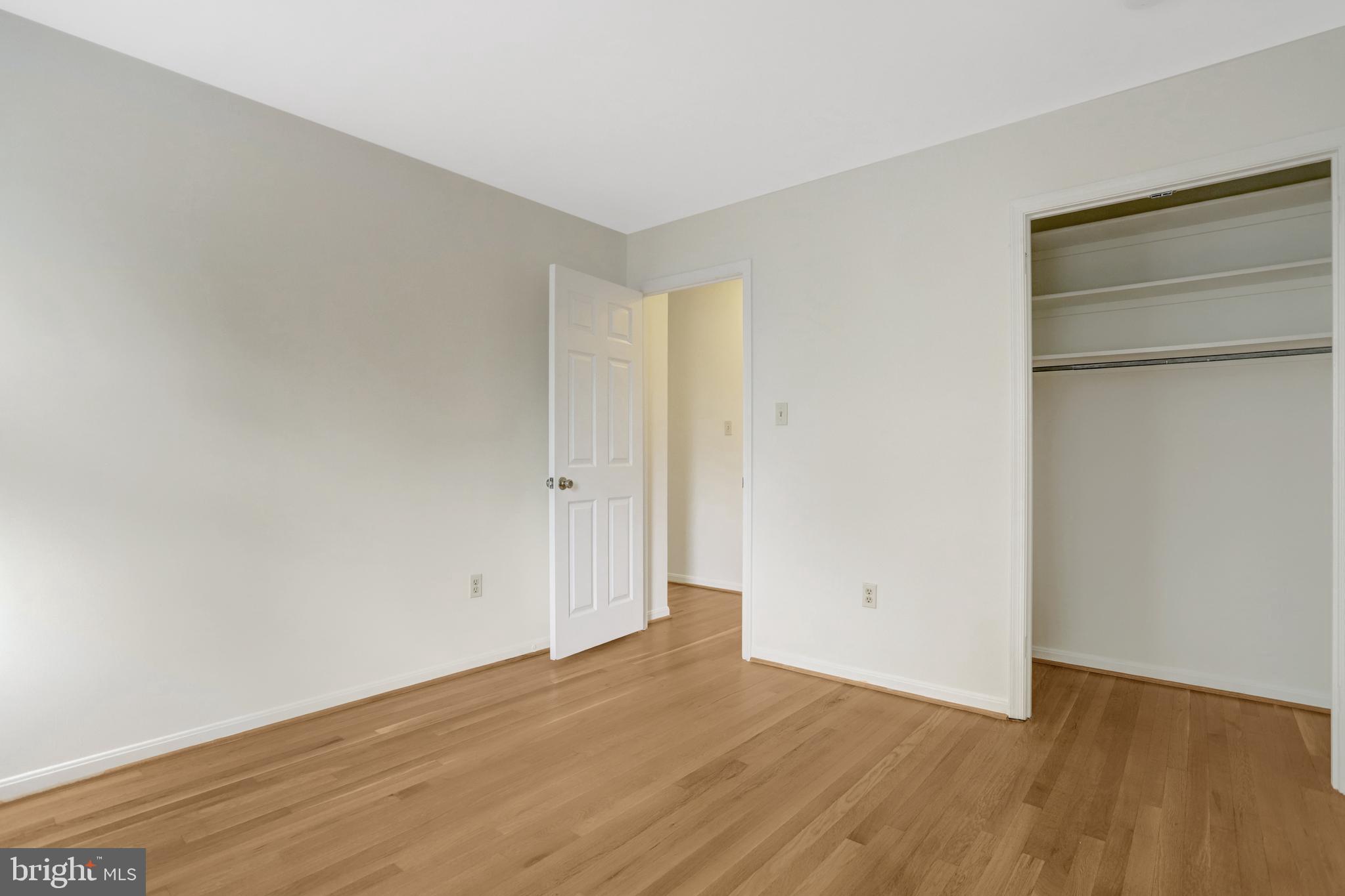 411 North Bryan Street Arlington, VA 22201 - Photo 43 of 58 a view of an empty room with wooden floor and closet