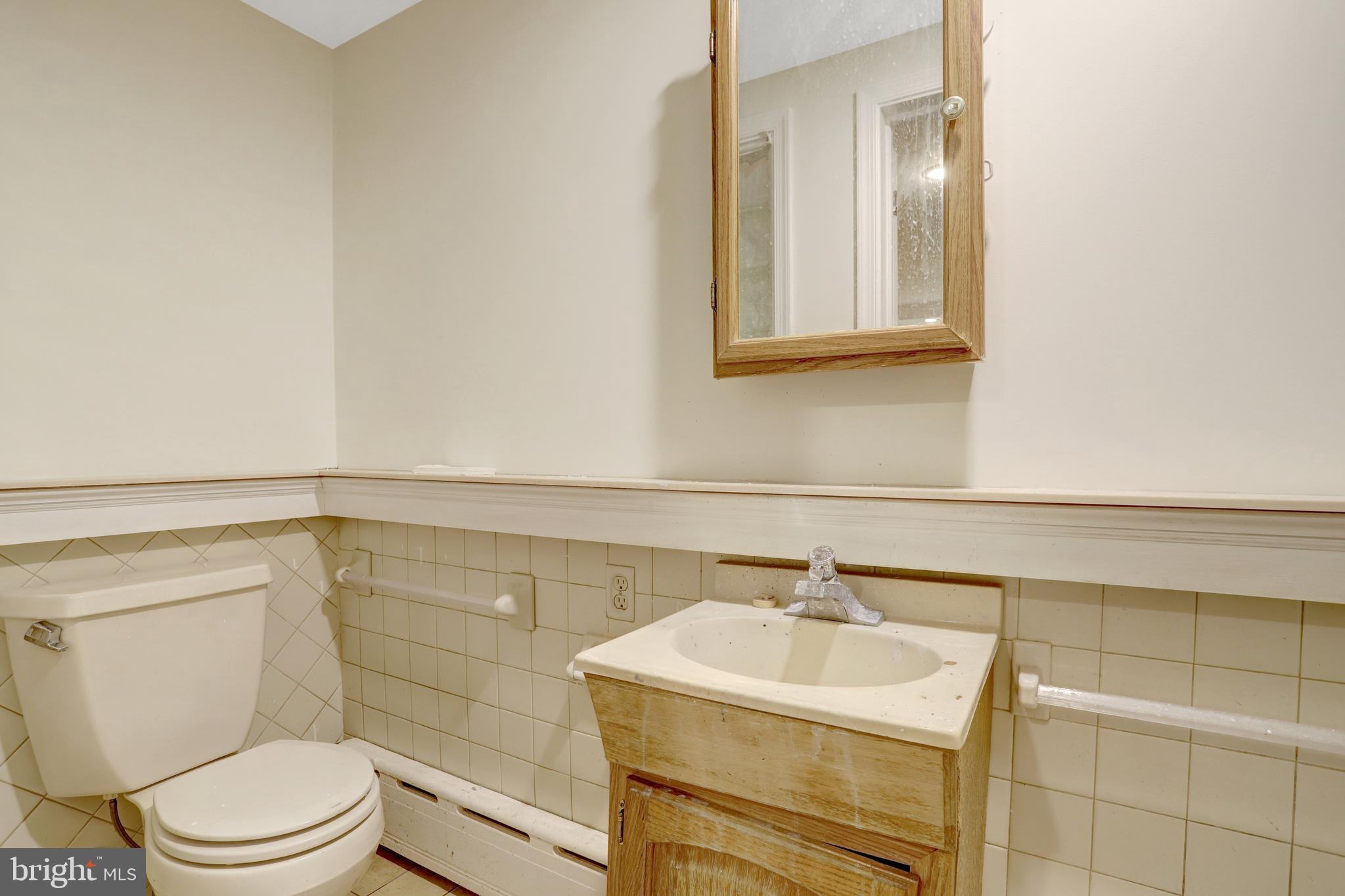 411 North Bryan Street Arlington, VA 22201 - Photo 54 of 58 a bathroom with a sink toilet and vanity