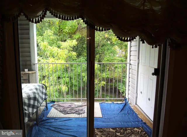 a view of a porch with wooden floor and outdoor space