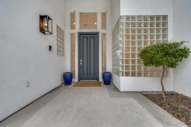 a view of an empty room with a potted plant