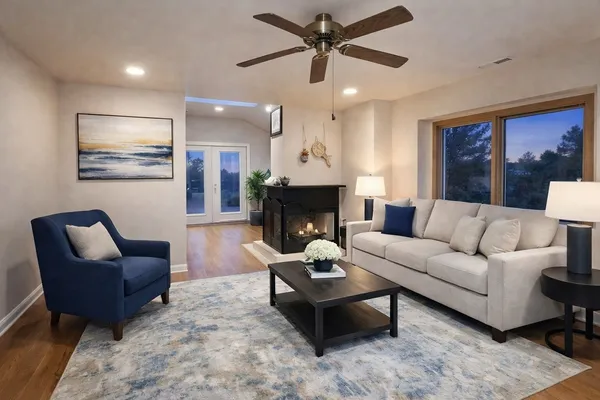 a living room with furniture and a fireplace