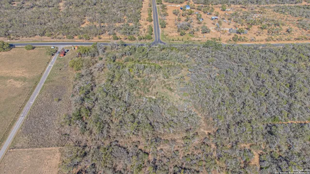 a view of a field with an ocean view
