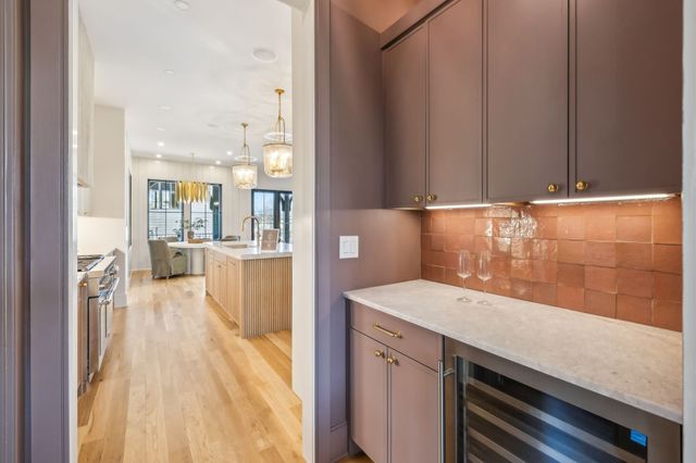 a living room with furniture a window and a fireplace