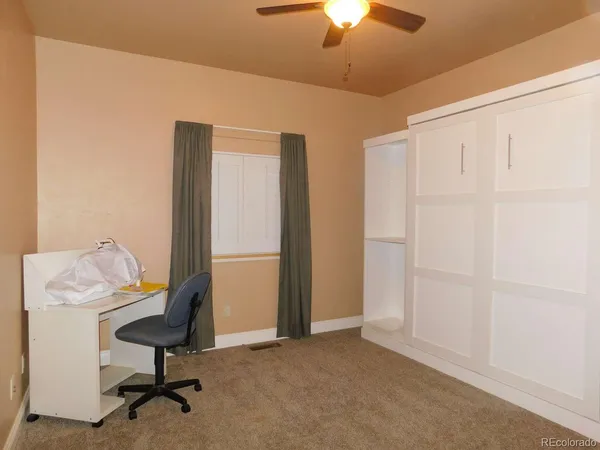 a view of a workspace with furniture