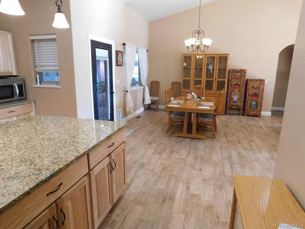a dining room with chandelier