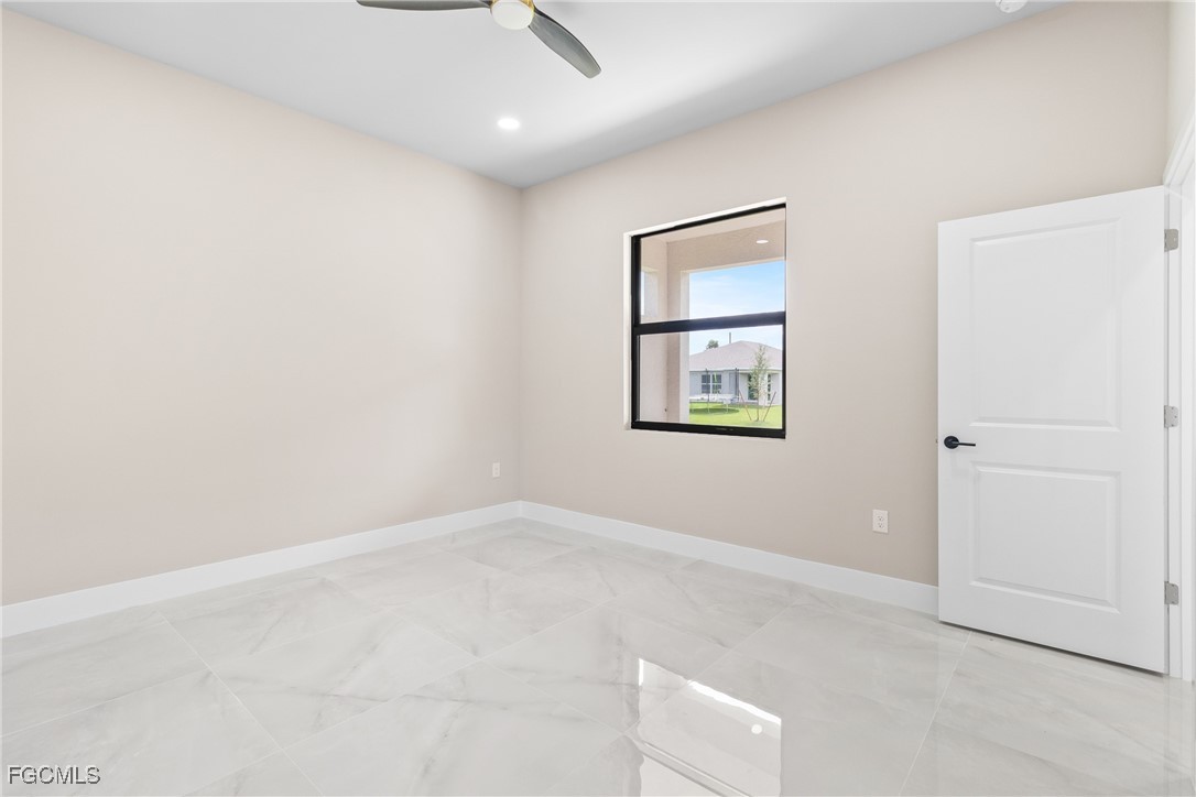 2809 25th Street Southwest Lehigh Acres, FL 33976 - Photo 18 of 36 an empty room with windows