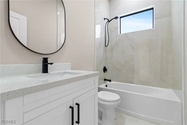 an empty room with closet and a hallway