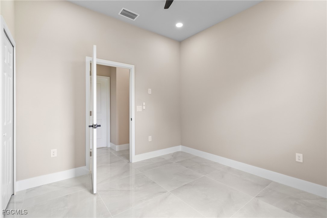 2809 25th Street Southwest Lehigh Acres, FL 33976 - Photo 26 of 36 an empty room with closet