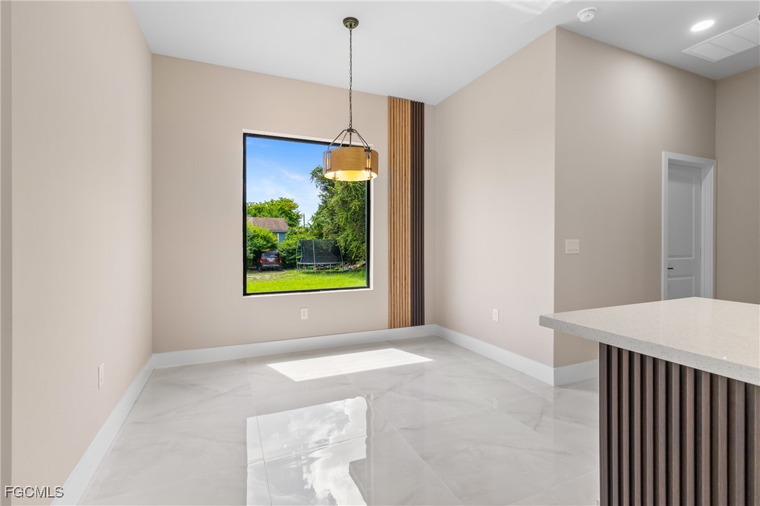 2809 25th Street Southwest Lehigh Acres, FL 33976 - Photo 29 of 36 a view of livingroom with window and outdoor view