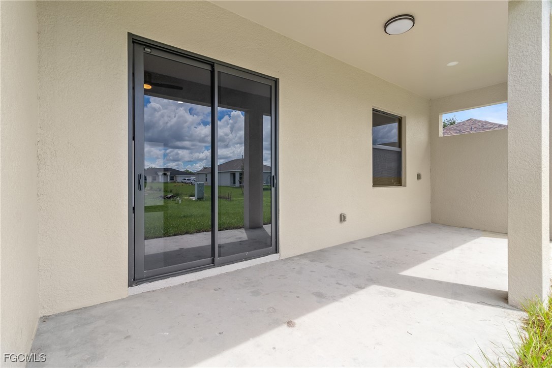 2809 25th Street Southwest Lehigh Acres, FL 33976 - Photo 35 of 36 a view of a room with a sink and glass door