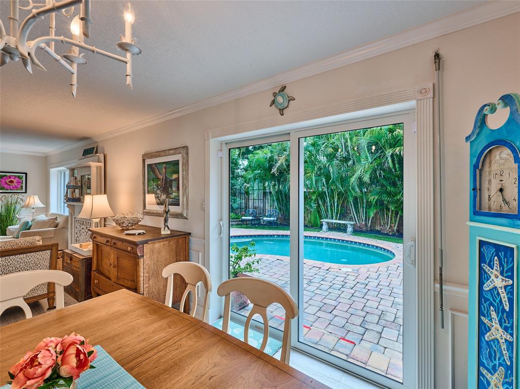 3220 Oleander Way Lauderdale-by-the-Sea, FL 33062 - Photo 12 of 50 a bedroom with furniture and a large window
